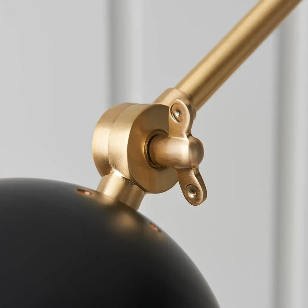 Lehal Swing Wall Light in Brass Finish