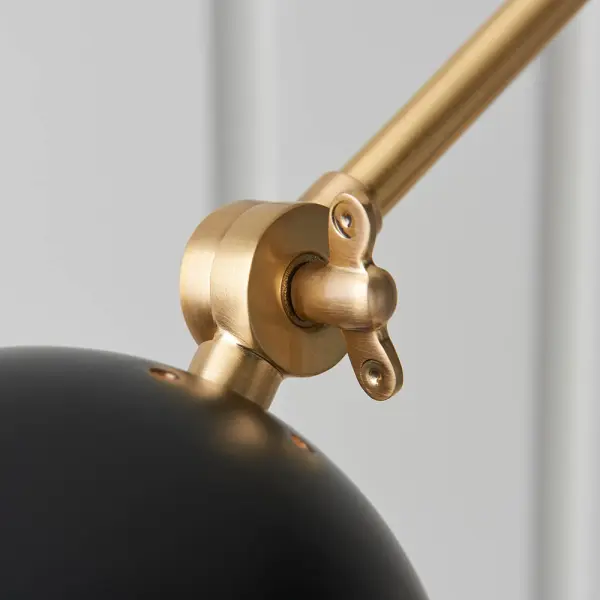 Lehal Swing Wall Light in Brass Finish