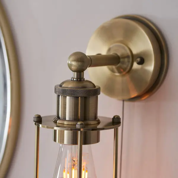 Industrial Style Wall Light Caged in Antique Brass