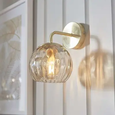 Dimple Wall Light in Brushed Brass with Champagne Glass