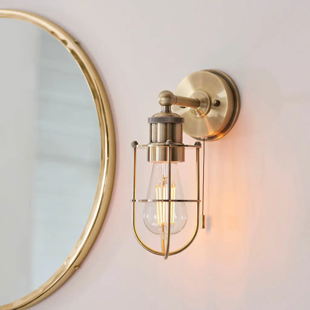 Industrial Style Wall Light Caged in Antique Brass