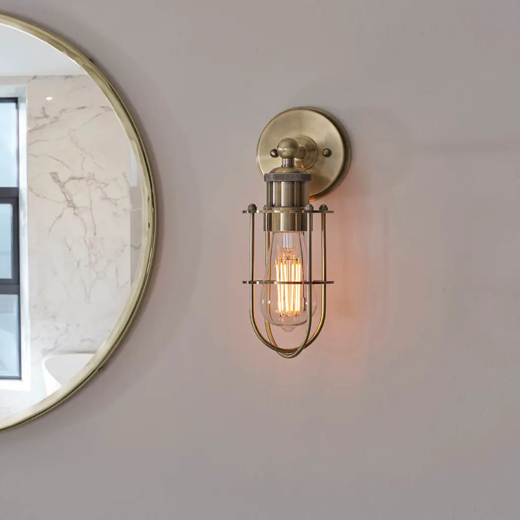 Industrial Style Wall Light Caged in Antique Brass