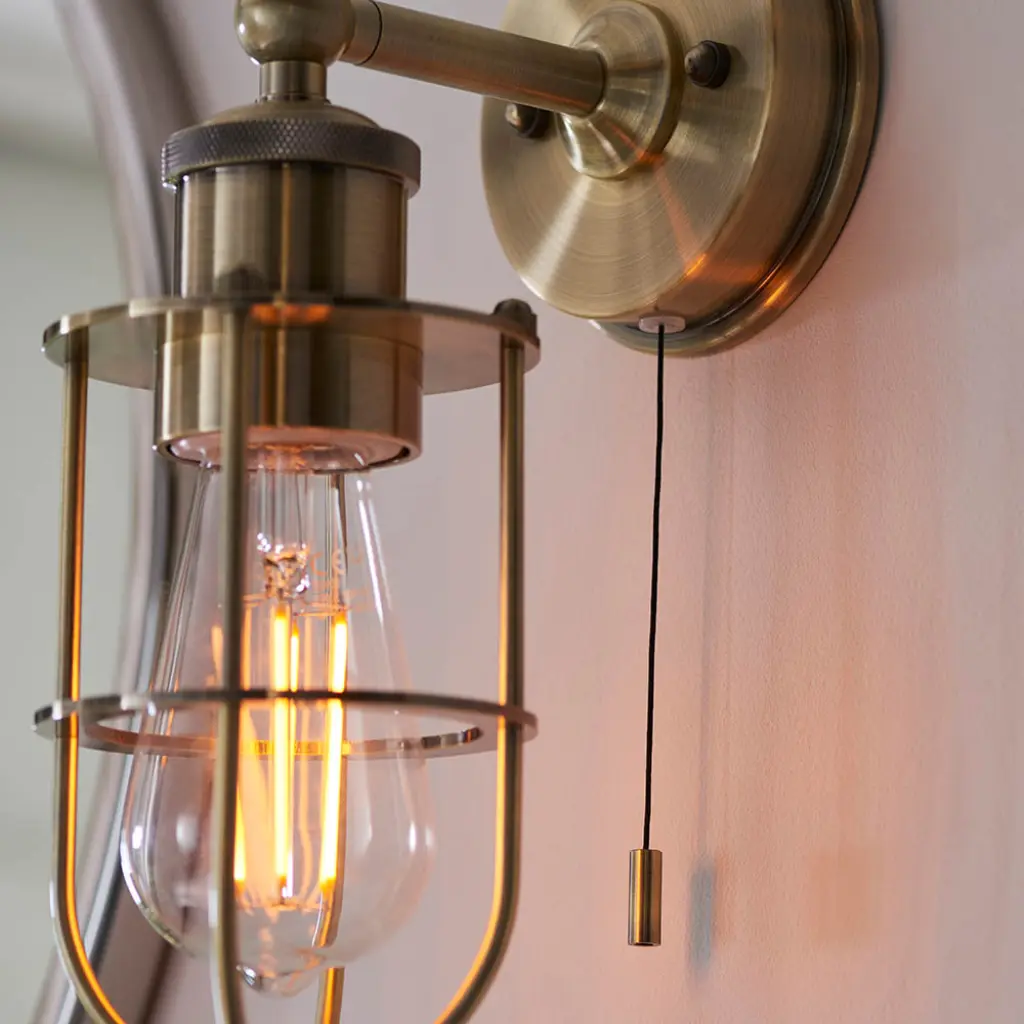 Industrial Style Wall Light Caged in Antique Brass